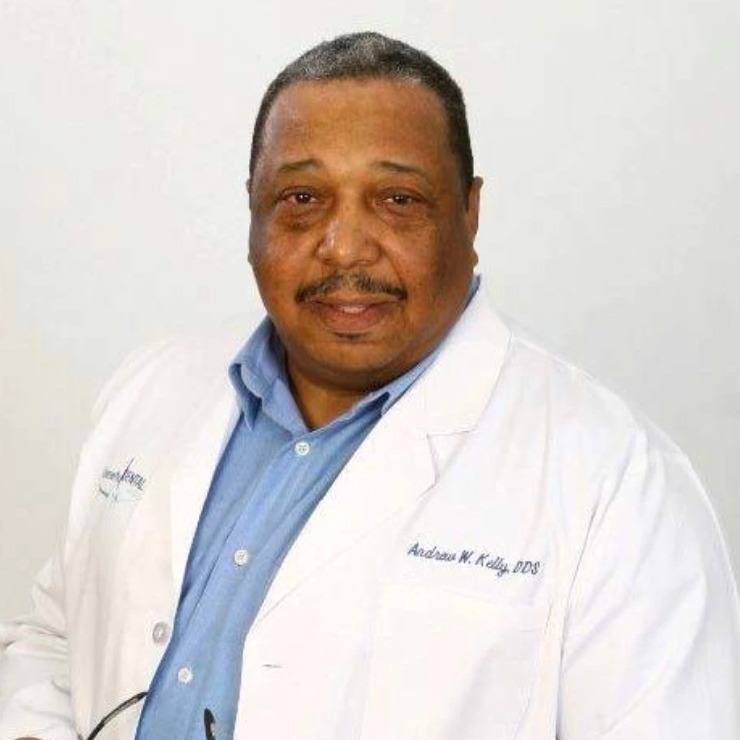 Portrait of Dr. Andrew Kelly in a white clinical coat