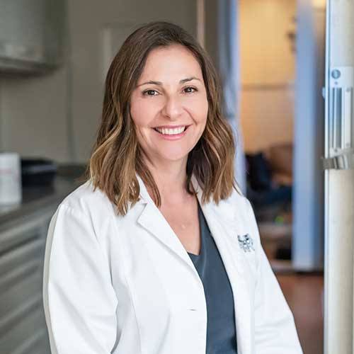Portrait of Dr. Veronika Vazquez in a white clinical coat